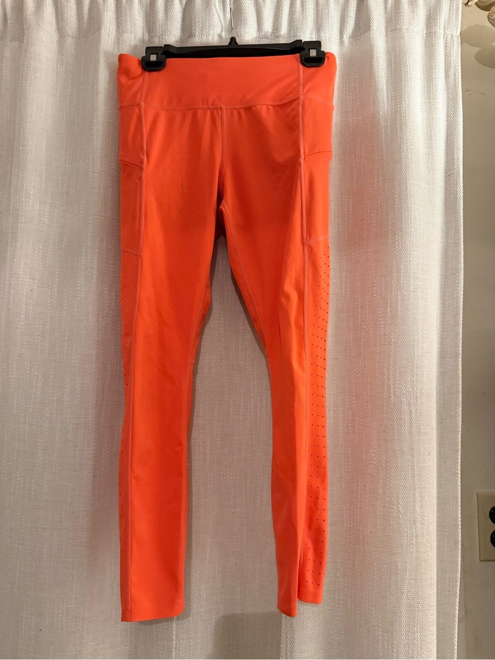 Athleta Contender Laser Cut Powerlift 7/8 Leggings in neon orange size S